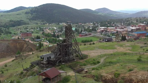 Abandoned mine shaft head structure, and small town, Victor, Colorado, USA Stock Footage 129212482