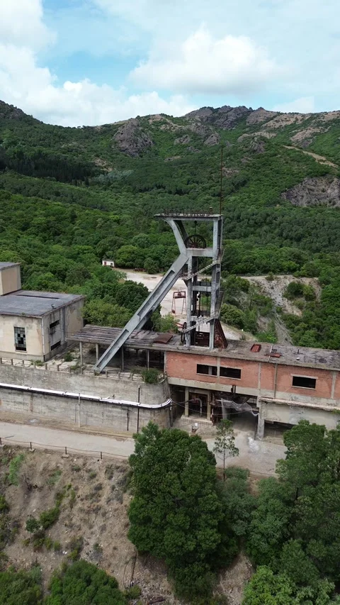 Abandoned Mining Complex of Montevecchio Surrounded by Sardinian Mountains Stock Footage 341670411