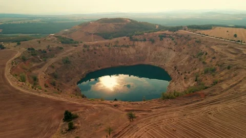 Abandoned  mining mine with turquoise blue water on the outskirts of Tsar Asen Stockbeeldmateriaal 230434568