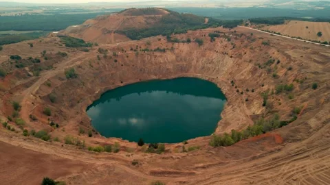Abandoned  mining mine with turquoise blue water on the outskirts of Tsar Asen Видео 230434572