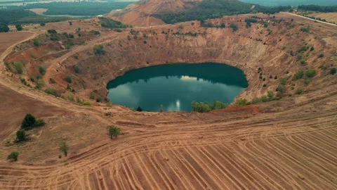 Abandoned  mining mine with turquoise blue water on the outskirts of Tsar Asen Vídeo Stock 230434621