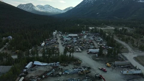 Abandoned Mining Town surrounded by epic Mountains, Aerial View Stock Footage 289486039