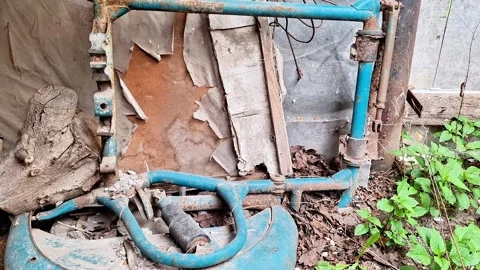 Abandoned Motorcycle Part in Neglected Rustic Junkyard Setting 動画素材 336360685