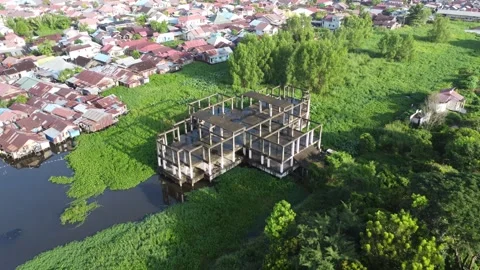 Abandoned multi storey building with only the building foundation visible Stock Footage 318077953