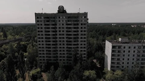 Abandoned multi-storey building with the Soviet coat of arms on the facade in th Stock Footage 72249038