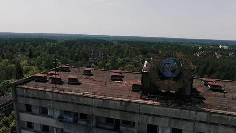 Abandoned multi-storey building with the Soviet coat of arms on the facade in th Stock Footage 72251085