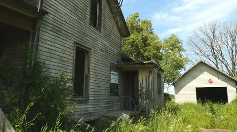 An abandoned old farm house on a closed down farm Stock Footage 63492221