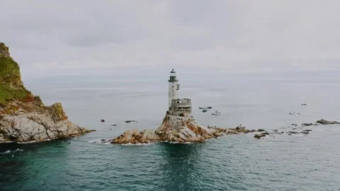 An abandoned old lighthouse on the cliffs by the sea. Stock Footage 315784714