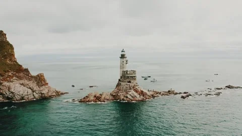 An abandoned old lighthouse on the cliffs by the sea. A beautiful planet. Stock Footage 315785706