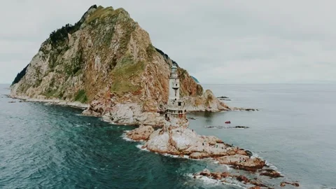 An abandoned old lighthouse on the cliffs by the sea. Sakhalin. Stock Footage 315785796