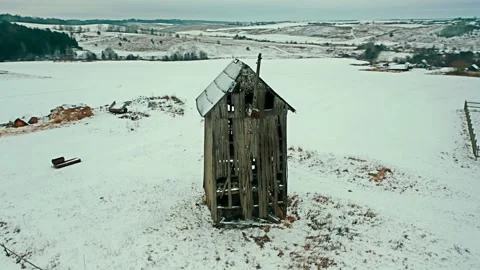 Abandoned old mill on a cloudy winter day. Scary wooden building. Stock Footage 166738907