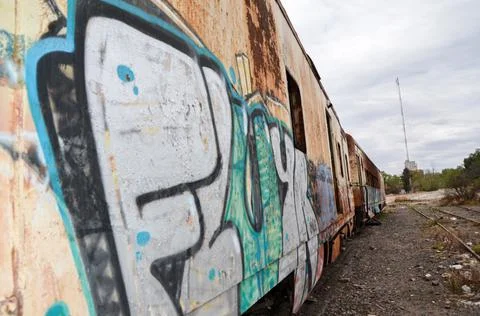 Abandoned old train with rust and graffitis Stock Photos