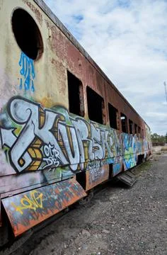 Abandoned old train with rust and graffitis Stock Photos