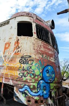 Abandoned old train with rust and graffitis Stock Photos
