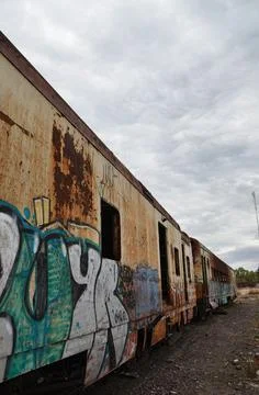 Abandoned old train with rust and graffitis Stock Photos