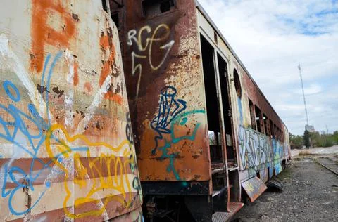 Abandoned old train with rust and graffitis Stock Photos
