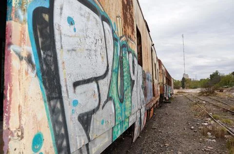 Abandoned old train with rust and graffitis Stock Photos