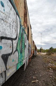 Abandoned old train with rust and graffitis Stock Photos