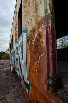 Abandoned old train with rust and graffitis Stock Photos
