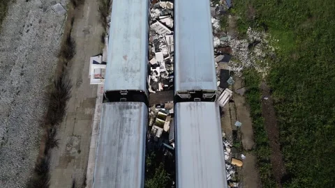 Abandoned old trains, garbage dump. Drone Stock Footage 299265661