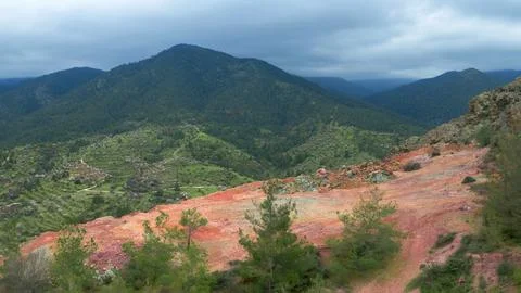 Abandoned open pit mine on mount Alestos, Cyprus. Red soil rich of iron and.. Stock Photos