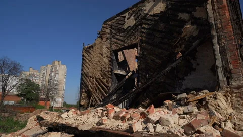 Abandoned partially destroyed brick burned down house in the city Stock Footage 119494716