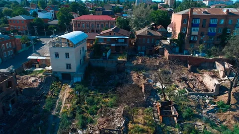 Abandoned partially destroyed brick burned down houses in the quarter city Stock Footage 119502978