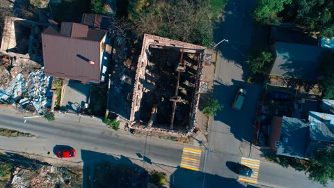 Abandoned partially destroyed brick burned down houses in the quarter city Stock Footage 119530179