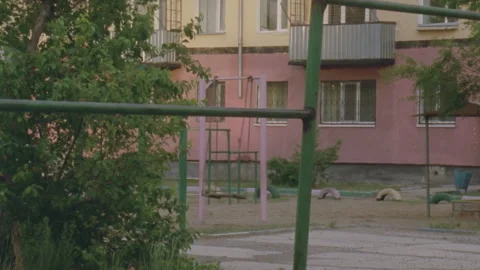 Abandoned playground with empty swing moving Stock Footage 330211304