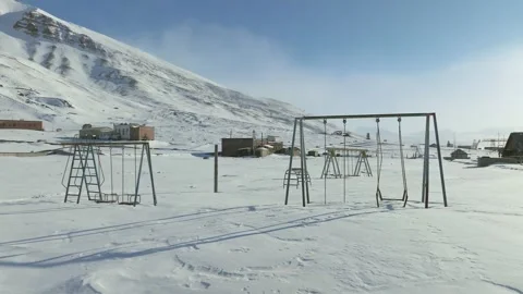Abandoned Playground in a Snowy Arctic Ghost Town with 4k Resolution Stock Footage 338265436