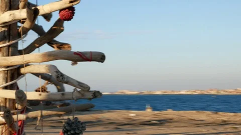 Abandoned Port. A Christmas tree made with old woods and the Lighthouse Stock Footage 101225741