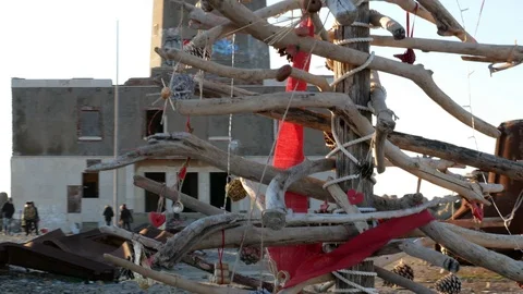 Abandoned Port. A Christmas tree made with old woods and the Lighthouse Stock Footage 101225813