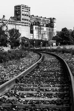 An abandoned rail tracks and a functional railroad in Montreal with rusty rails Stock Photos