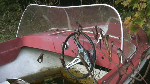 Abandoned red motorboat. Closeup. Stock Footage