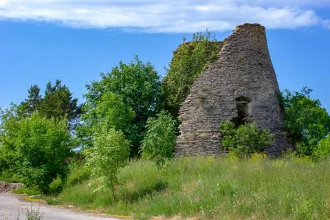 Abandoned remnants of the limestone base of an old windmill. Stock Photos