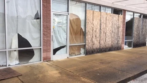 Abandoned retail store front in poverty neighborhood with social issues Stock Footage 82093483