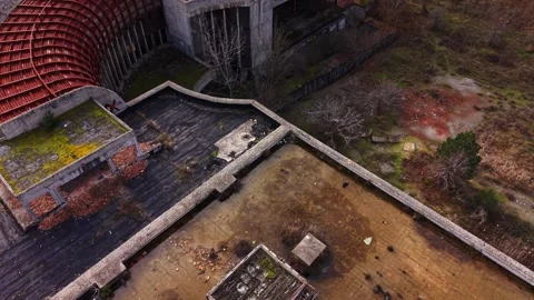 Abandoned rooftop view of a derelict building surrounded by nature Stock Footage 327144380