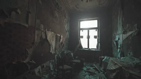 Abandoned room with damaged walls and broken furniture, sunlight through window Stock Footage 303523975
