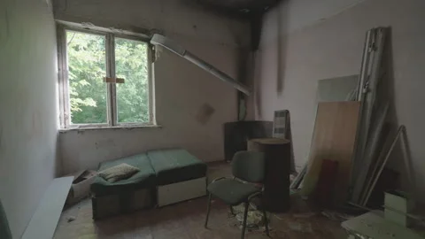 Abandoned Room Interior with Broken Window and Fire Damage | Urban Decay Stock Footage 336142908