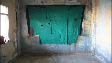 Abandoned Room Interior with Covered Window and Peeling Walls Stock Footage 332150718