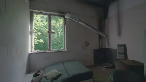 Abandoned Room with Old Sofa Pillow Burned Ceiling Push-In Shot | Ventilation Stock Footage 335493670