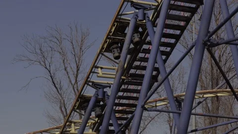An abandoned, rust-covered roller coaster ride in an abandoned amusement park. Stock Footage 151523974