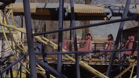 An abandoned, rust-covered roller coaster ride in an abandoned amusement park. Stock Footage 151545262