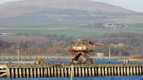 Abandoned Rusted Dockside Crane on Old Wooden Harbour Pier Video stock 335885541