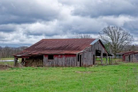 Abandoned rustic red barn Stock Photos