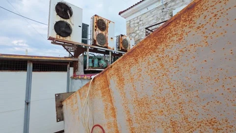 Abandoned Rusty Air Conditioning Units Exposed to Weather Stock Footage 306311868