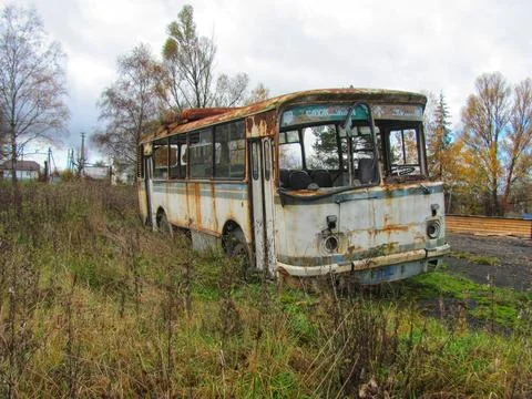 Abandoned Rusty Bus on Roadside Stock Photos