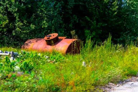 Abandoned rusty container for combustible materials. Dead military unit. Cons Stock Photos