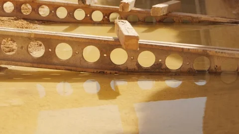 Abandoned rusty metal beam in a puddle Stock Footage 263716808