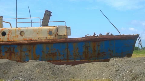Abandoned rusty ship standing on the shore of the Black Sea Stock-Footage 94136871